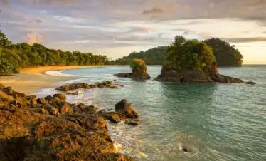 Scenic Sunset View and Dramatic Landscape of Playa Espadilla Beach in Manuel Antonio National Park Costa Rica